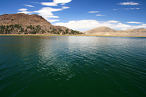 Arid mountains rising beside the lake