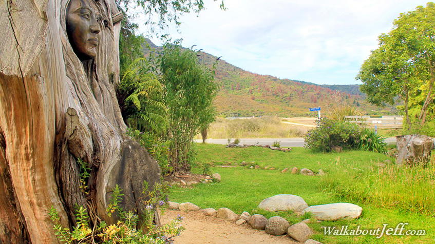 Carved faces of windy garden