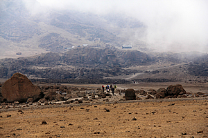 The cloud clears revealing Kibo Hut still a long way away